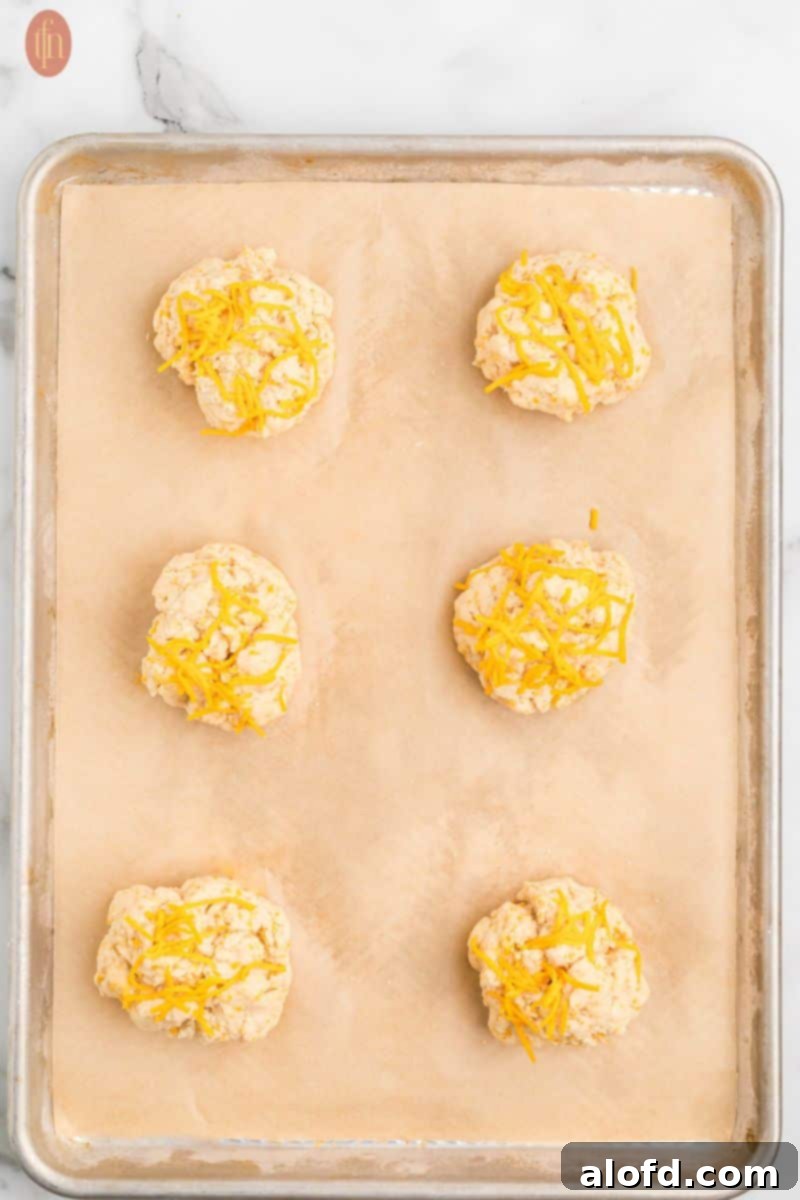 Cheddar Bliss Bites 9 Batter on a baking sheet