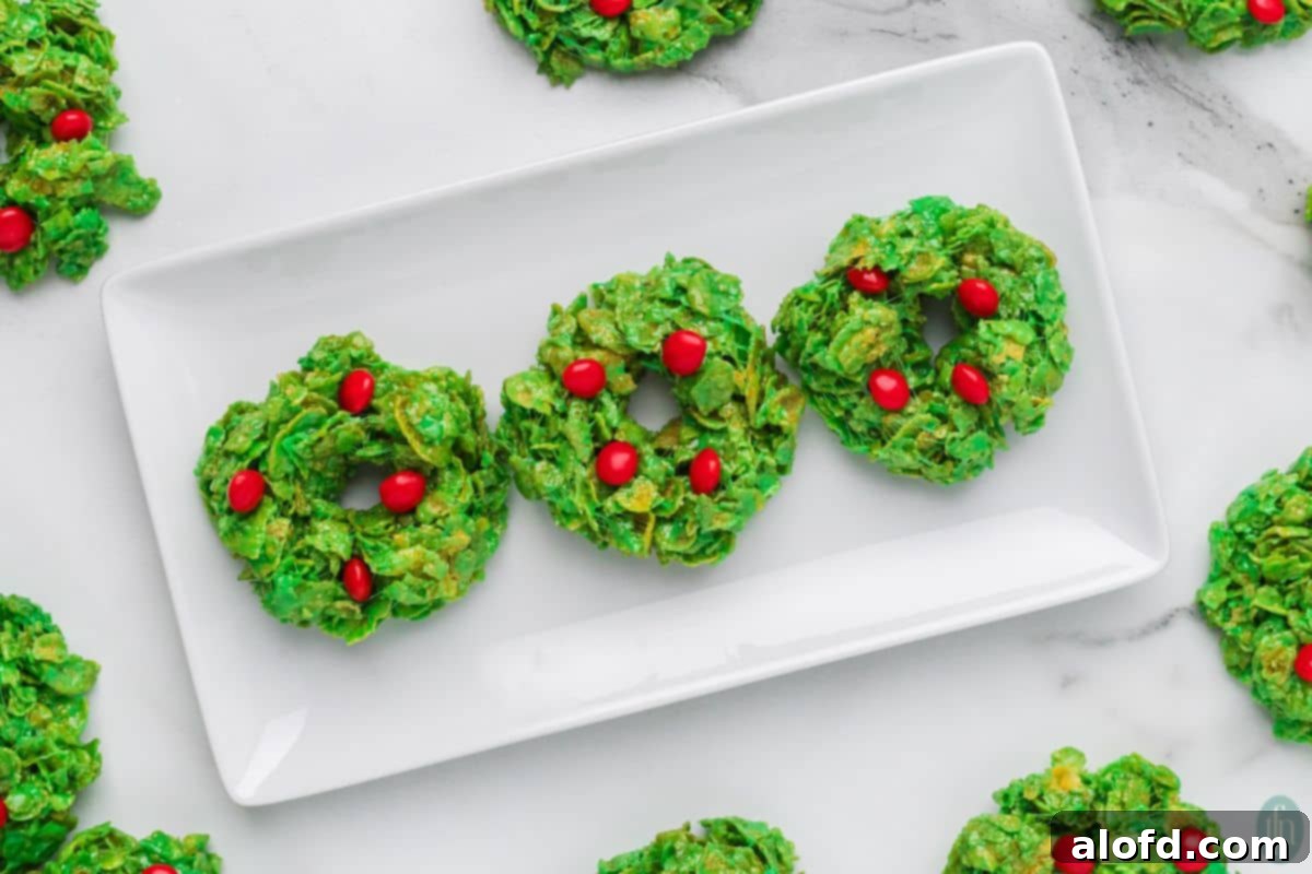 Christmas Wreath Cereal Cookies 10 A beautiful plate of freshly made No-Bake Christmas Cornflake Wreath Cookies, perfect for a holiday gathering.