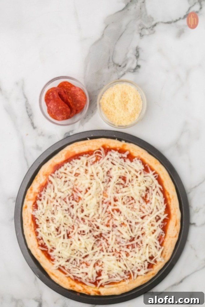 Homemade Pizza with a Crust Made from Scratch 11 Dough topped with marinara and mozzarella cheese.