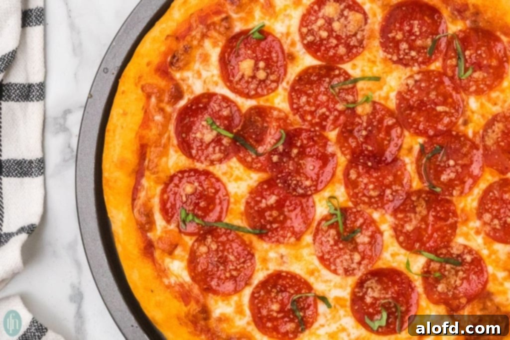 Homemade Pizza with a Crust Made from Scratch 3 A delicious homemade pizza with sliced pepperoni.