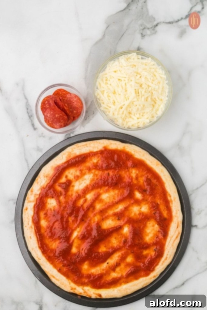 Homemade Pizza with a Crust Made from Scratch 10 Dough topped with marinara, cheese, and pepperoni.