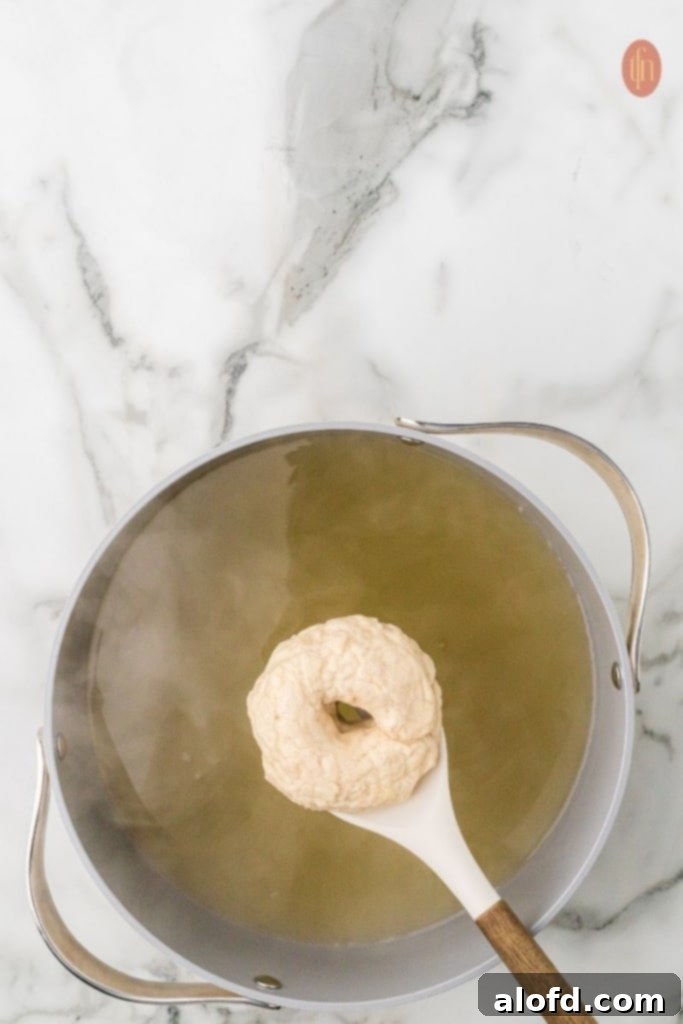 Sourdough Bagels Artisan Sourdough Bagels 13 Bagel in boiling water.