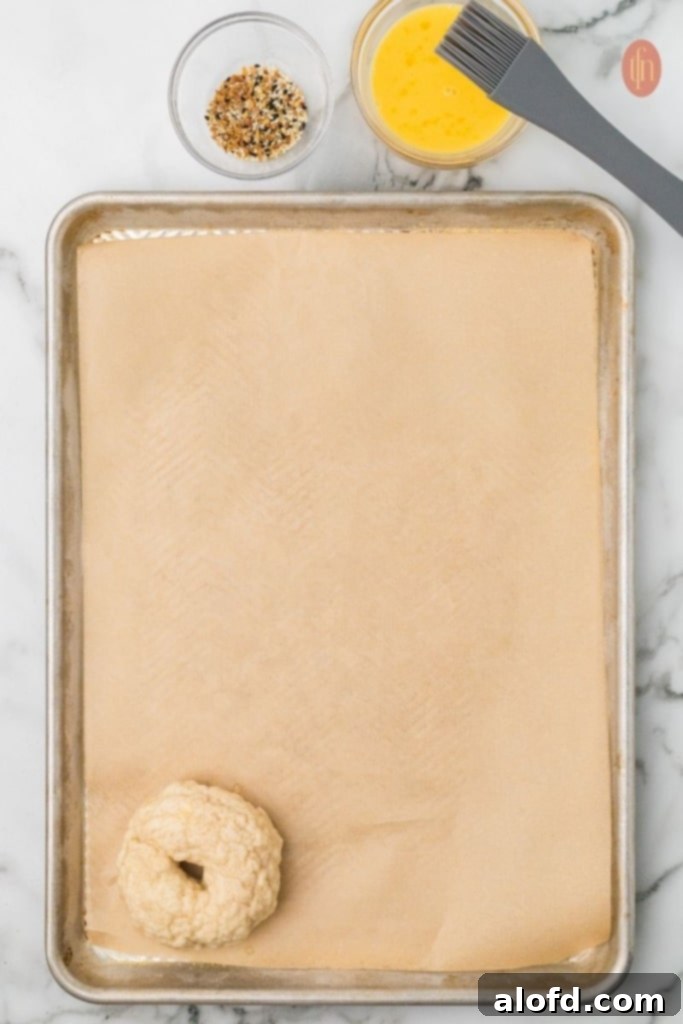 Sourdough Bagels Artisan Sourdough Bagels 14 Bagel with egg wash and seasoning.