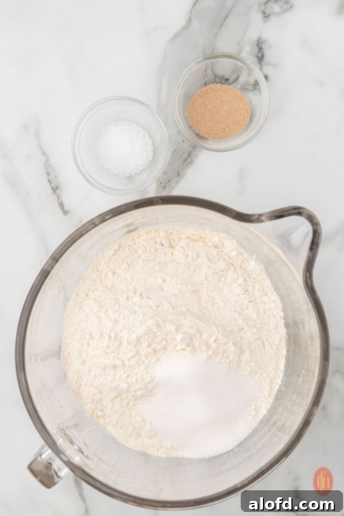 Sourdough Bagels Artisan Sourdough Bagels 7 Dough in a stand mixer with yeast and sugar.