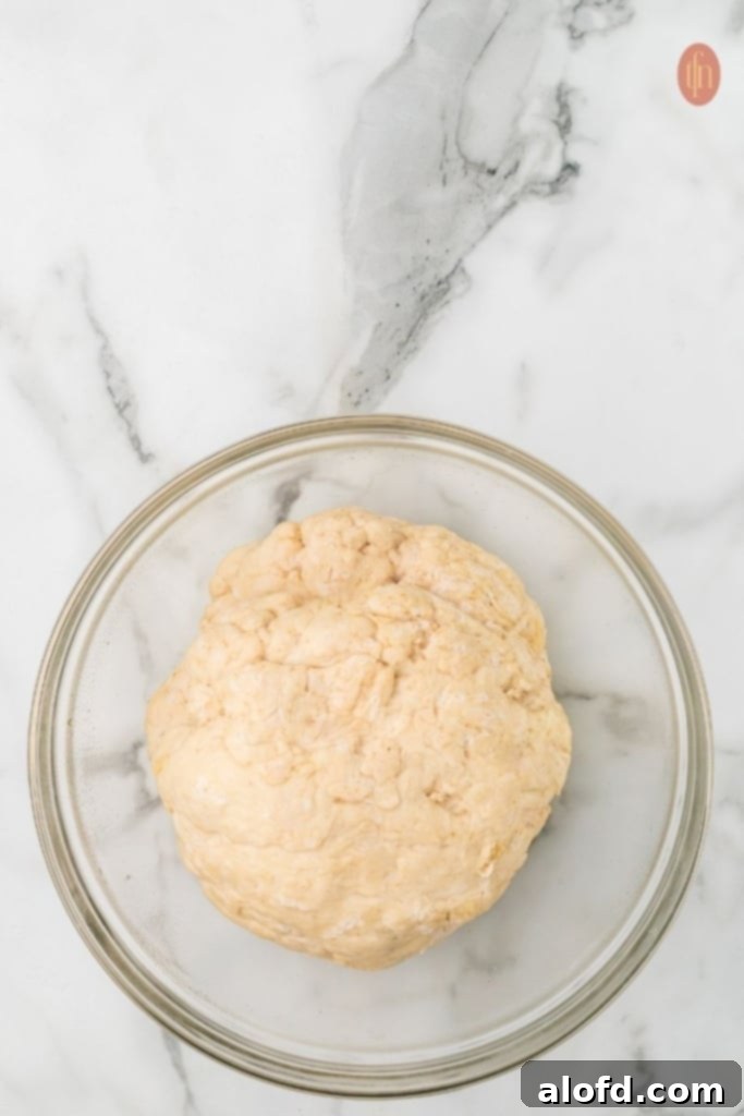Sourdough Bagels Artisan Sourdough Bagels 10 Dough rising in a bowl.