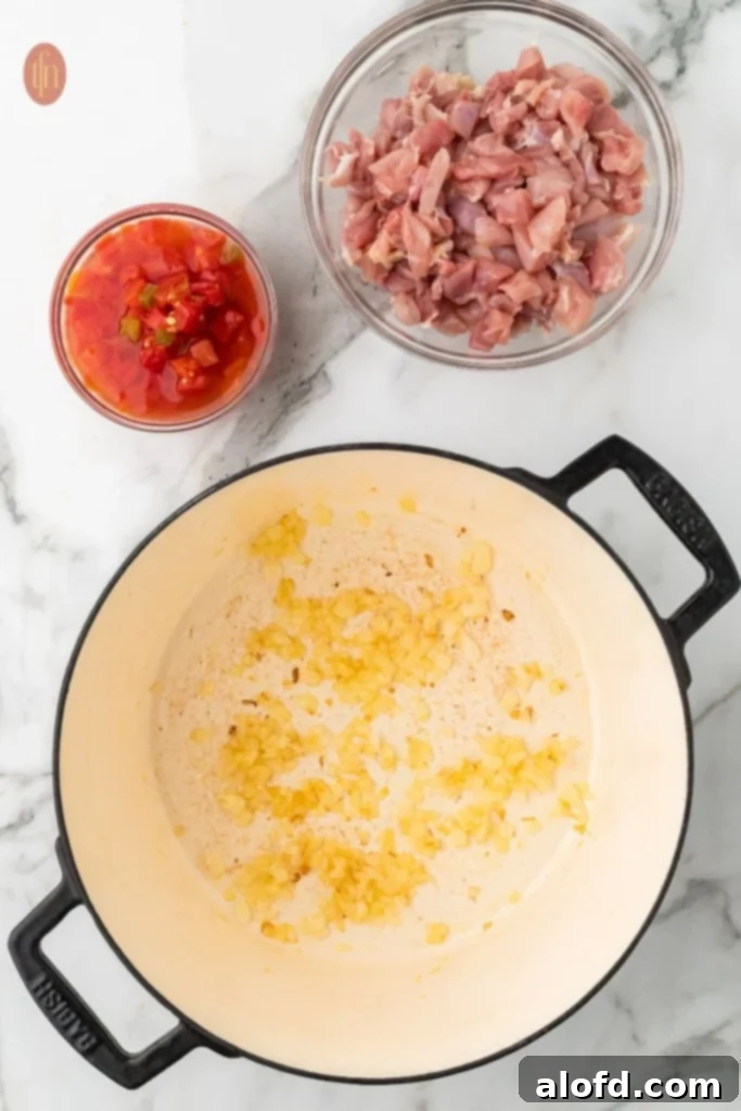 Chicken Taco Soup Delight 6 Sautéed onions with chicken and Rotel