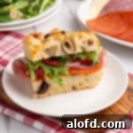 A slice of bread on a white plate.