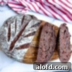Sliced chocolate sourdough bread on a cutting board.