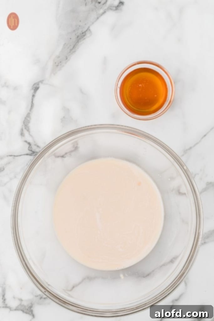 Quick Dinner Rolls 6 Two bowls of ingredients for dinner rolls.
