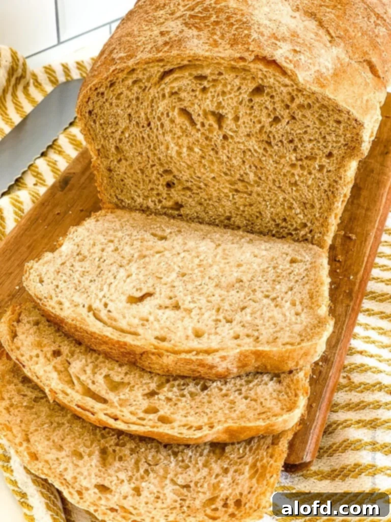Choosing the Right Flour for Your Baking Project 4 A beautifully baked loaf of whole wheat sourdough bread on a wooden board.